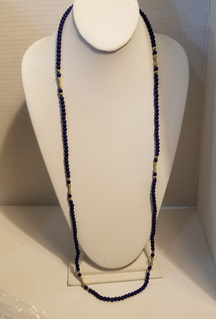 Twenty four inch royal blue beaded necklace w/gold accents screw closed clasp